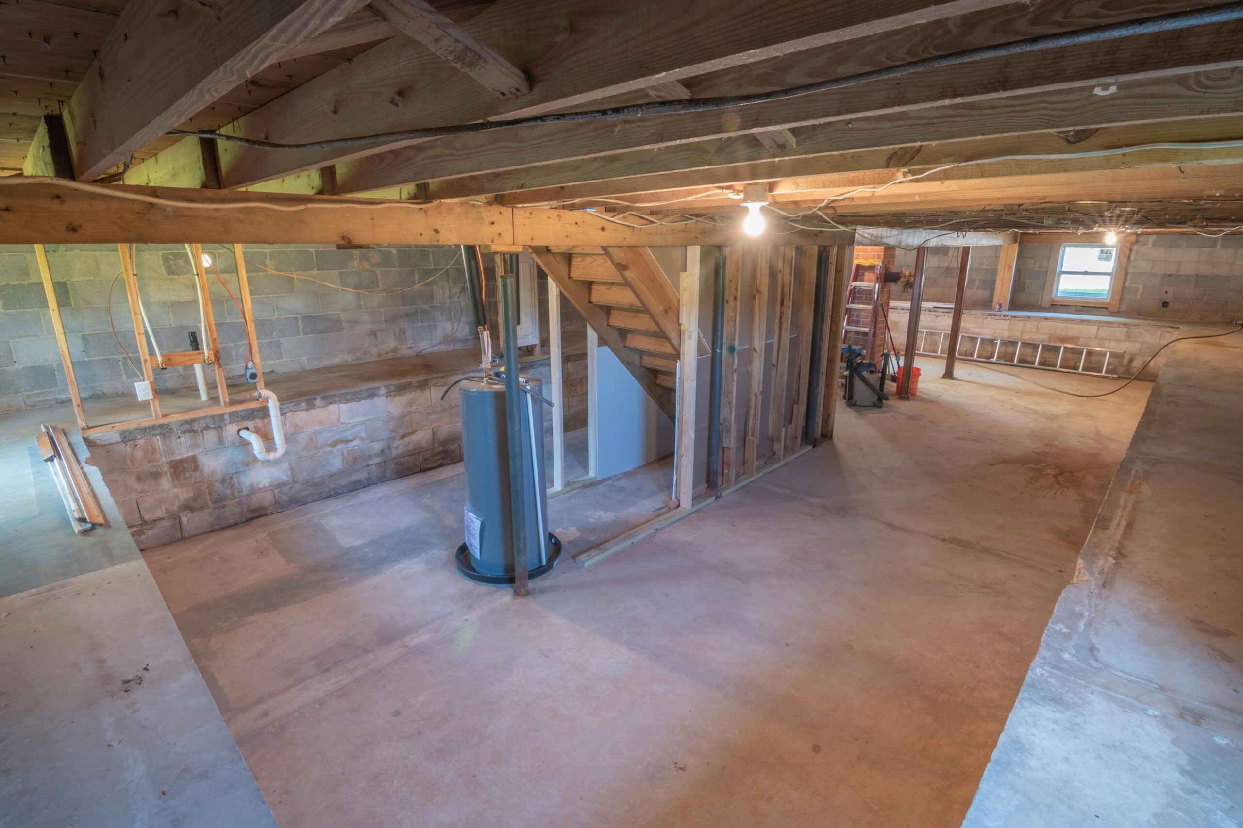 Water heater tank located in the attic of a house.